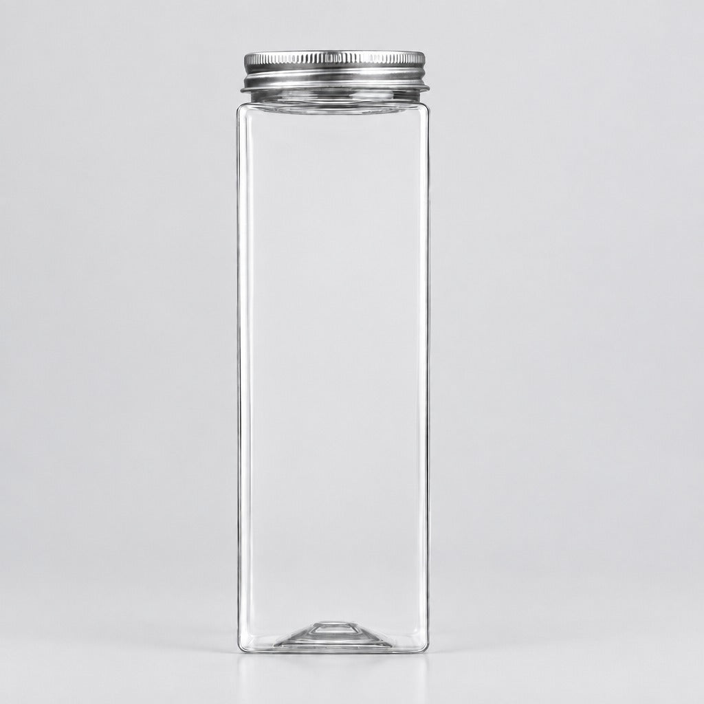 A tall, rectangular clear glass bottle with a silver metal screw cap, shown against a plain light gray background.