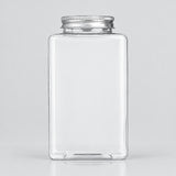 A clear rectangular glass jar with a silver metal screw cap, shown on a light gray studio background.