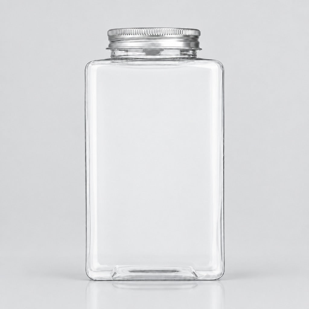 A clear rectangular glass jar with a silver metal screw cap, shown on a light gray studio background.