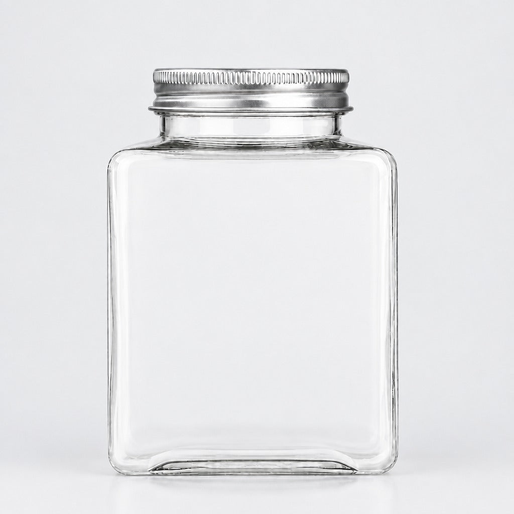 A clear glass jar with a square shape and a silver metal screw-on lid, shown against a plain light gray background.