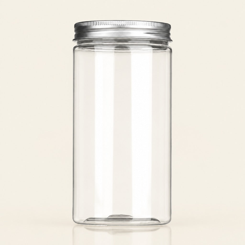 A tall, clear cylindrical plastic jar with a silver metal screw-on lid, shown on a plain light beige background.