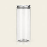 A tall, clear cylindrical plastic jar with a silver metal screw-on lid, shown against a solid light beige background.