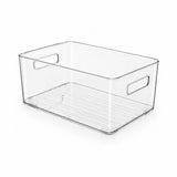 Clear plastic storage bin with integrated side handles and a slotted bottom tray, shown on a white background.
