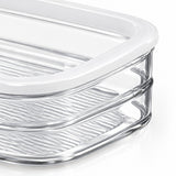 Clear glass storage container with a white lid, shown in a close-up studio shot on a white background.
