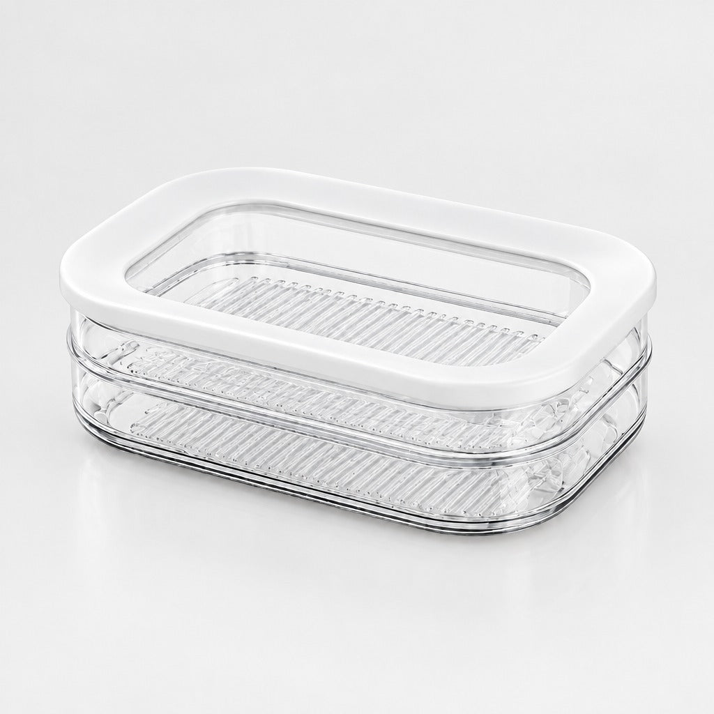 A clear plastic food storage container with a white lid, featuring two stacked perforated trays, shown on a clean white background.
