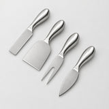 Four stainless steel cheese knives with polished handles arranged diagonally on a light gray background.