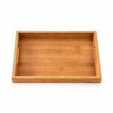 A rectangular bamboo serving tray with a natural warm brown color and visible wood grain texture, shown from a top-down perspective on a white background.