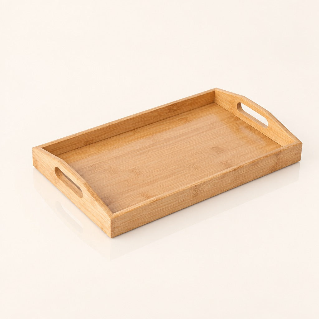 A rectangular bamboo serving tray with integrated cutout handles on two short ends, shown on a clean off-white background.