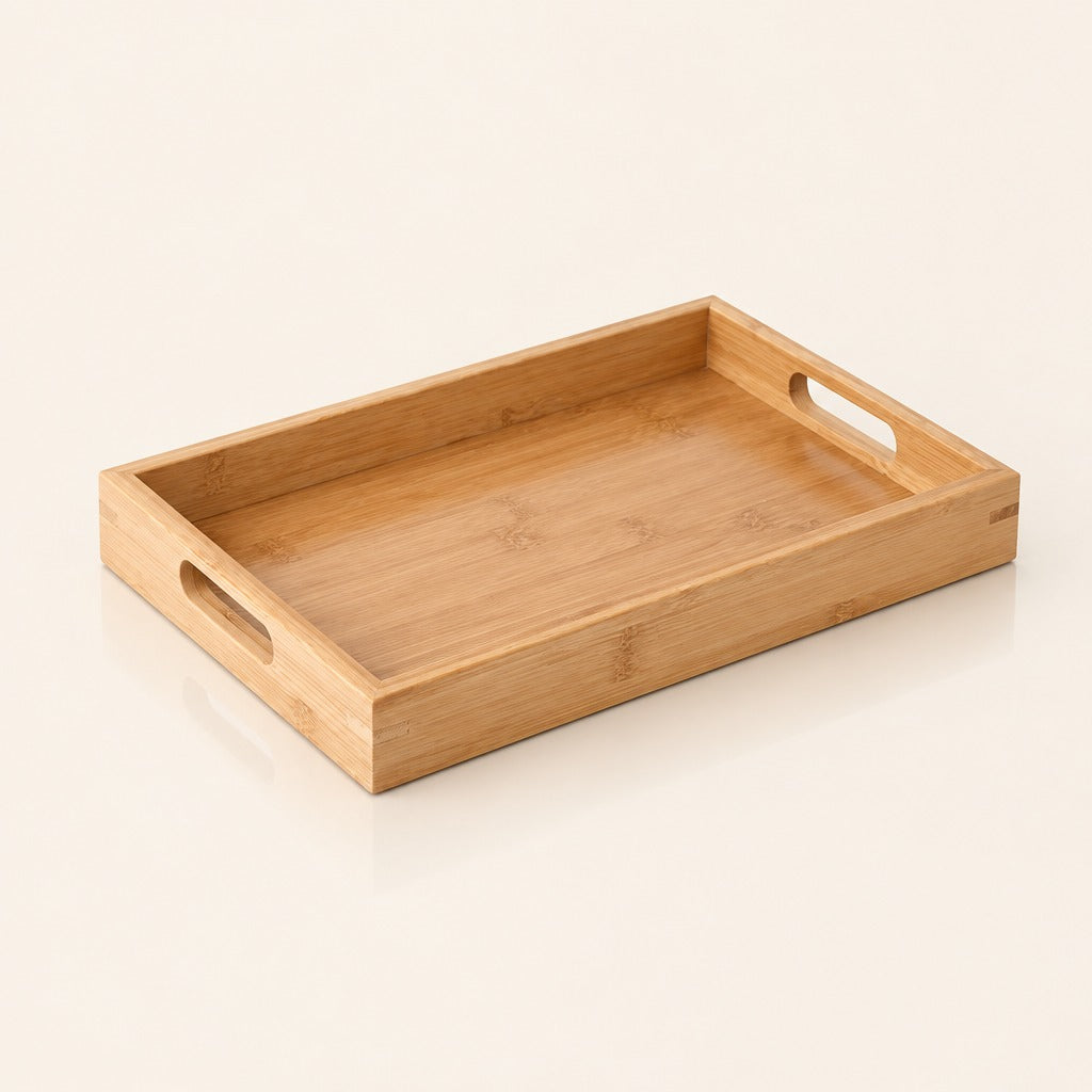 A rectangular bamboo serving tray with two oval cutout handles on the sides, shown on a clean off-white background.