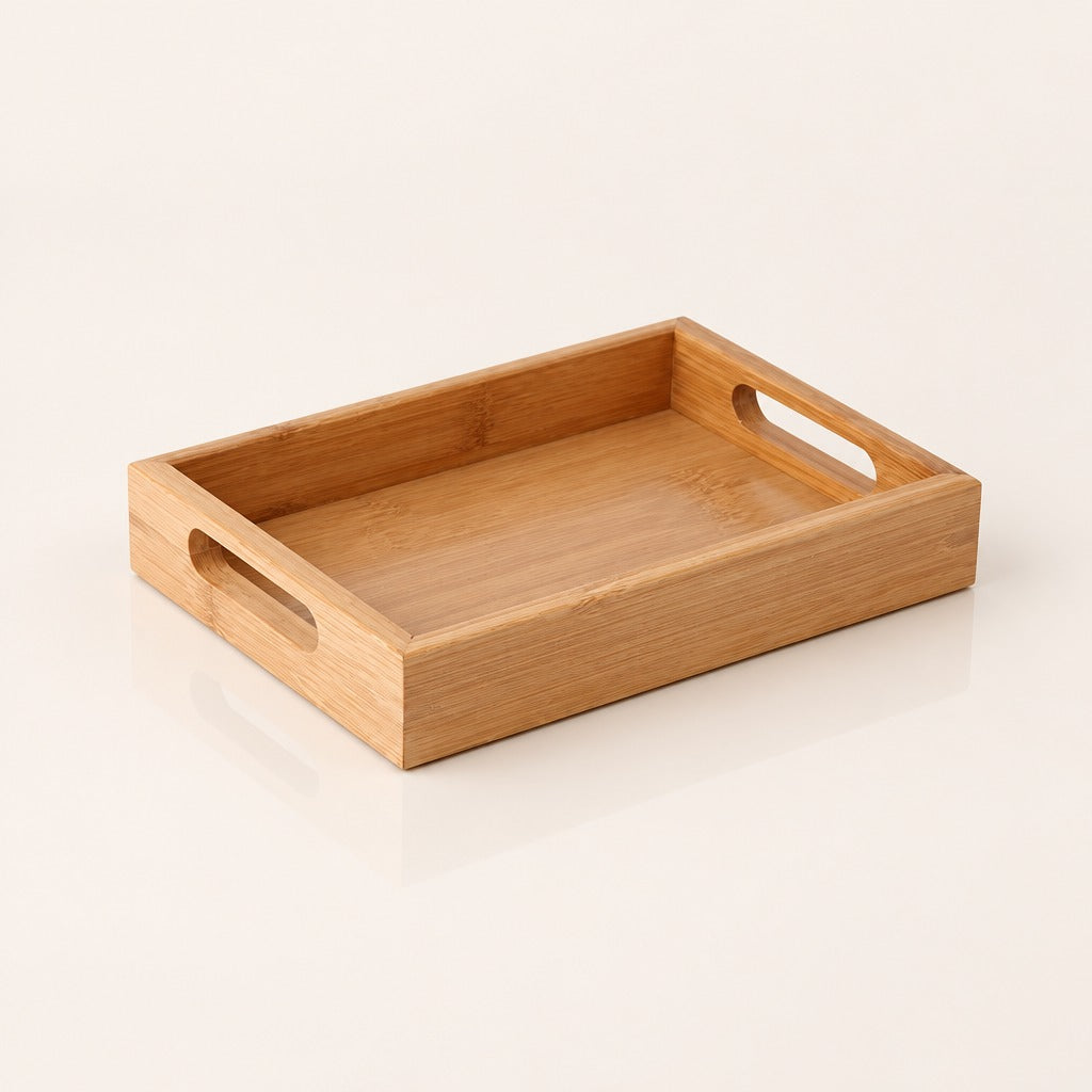 A rectangular bamboo serving tray with two oval cutout handles on the sides, shown on a clean off-white background.