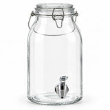 Clear glass beverage dispenser jar with a metal clamp lid and stainless steel spout, shown on a white background.