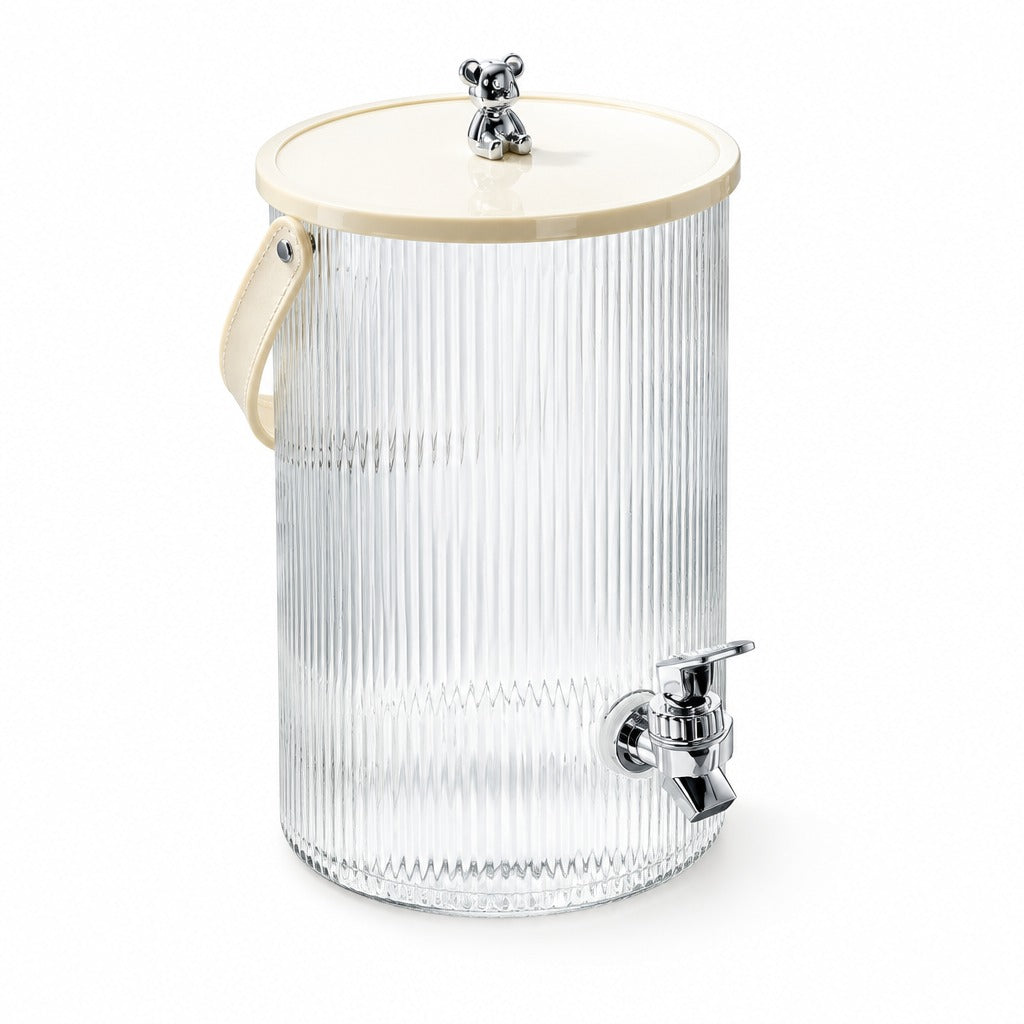A ribbed clear glass beverage dispenser canister with a cream-colored lid, cream handle, and chrome metal spigot, shown on a white background.