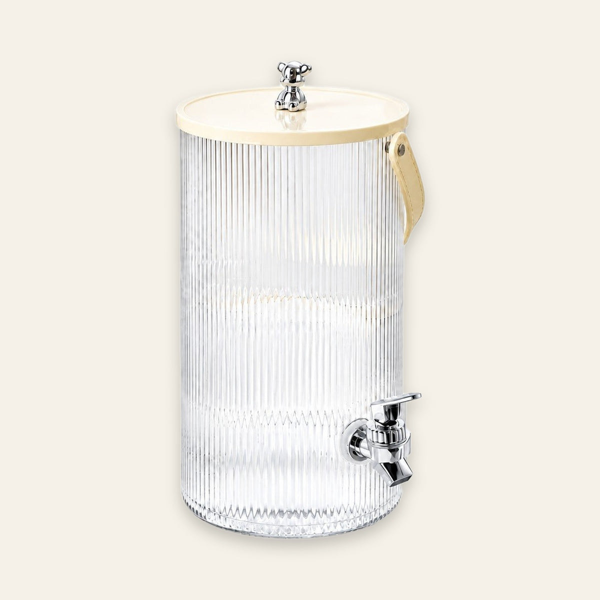 A tall ribbed clear plastic beverage dispenser with a cream-colored lid, a beige carrying handle, and a chrome metal spigot, shown against a solid light beige background.