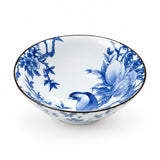 A white ceramic bowl decorated with blue floral and bird motifs, featuring a thin dark rim, shown on a clean white background.