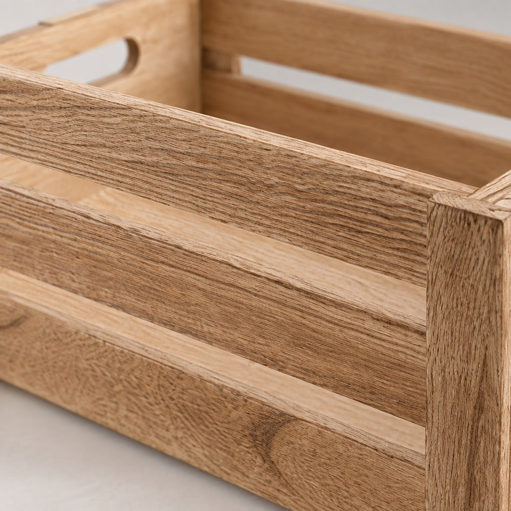 Close-up of a light oak wood storage crate with a natural grain finish and a cutout handle visible on the side.