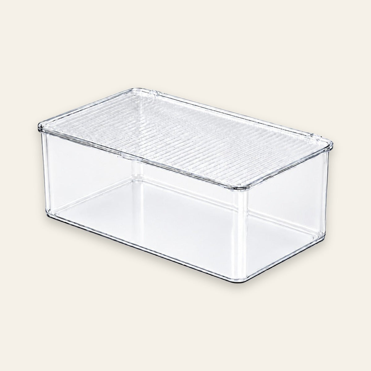 A clear plastic rectangular storage box with a ribbed lid, shown on a solid light beige background.