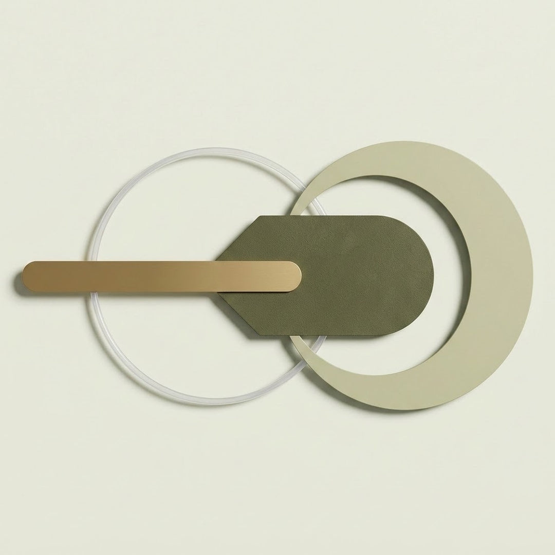 A minimalist geometric wall light fixture with overlapping circular and curved metal elements in beige, olive green, and brushed gold, shown against a solid off-white background.