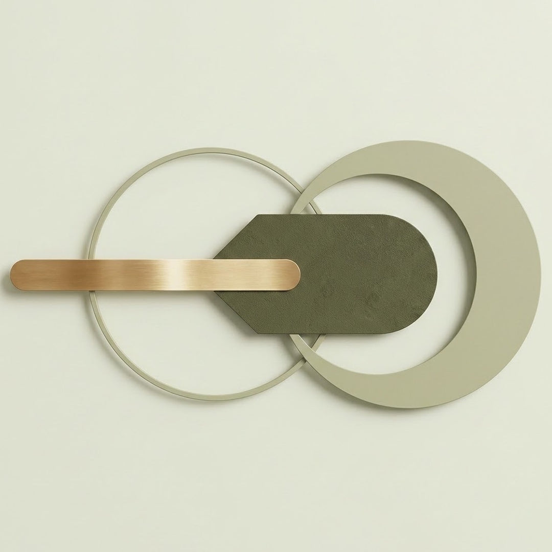Modern wall-mounted light fixture with overlapping circular and curved metal elements in matte gray, olive green, and brushed gold, shown against a plain off-white wall.