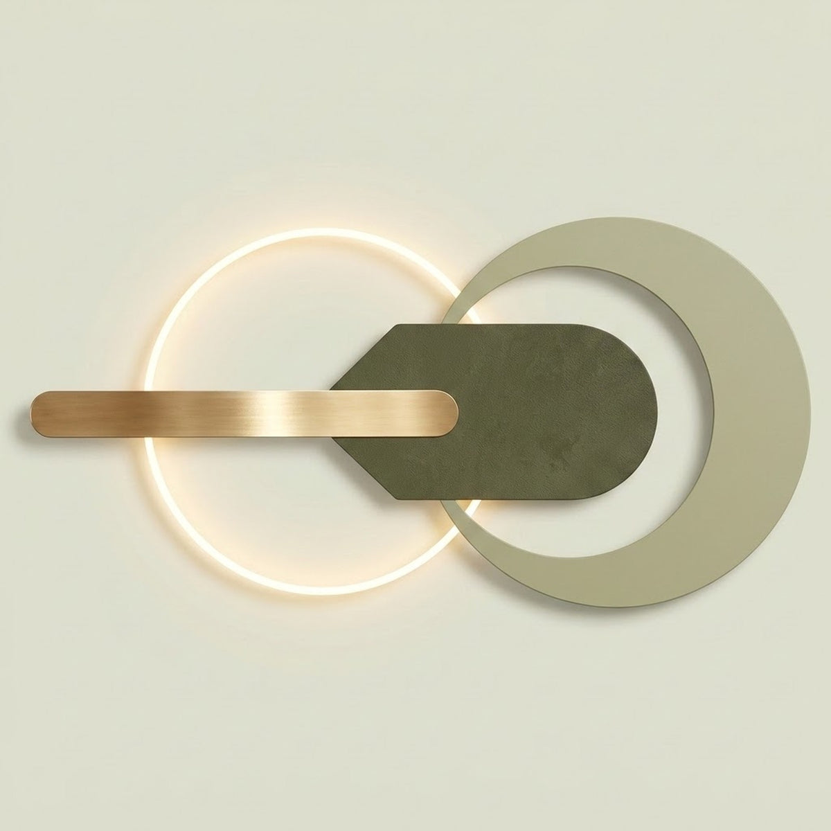 Modern wall-mounted light fixture with a glowing circular ring, a matte olive green geometric central element, and a brushed brass horizontal bar on a light beige background.