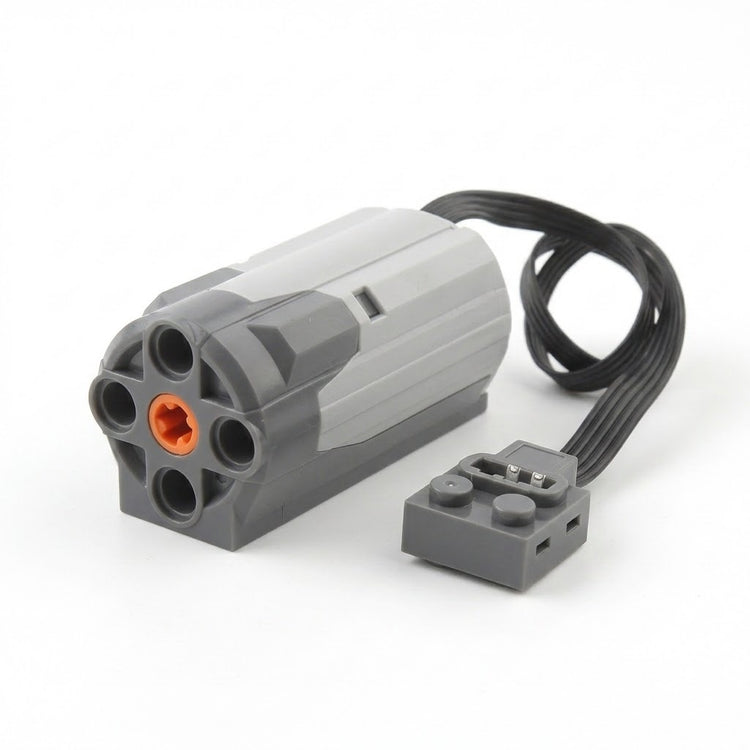 A grey building block motor component with orange axle socket, black cable and grey connector sits against a white background.