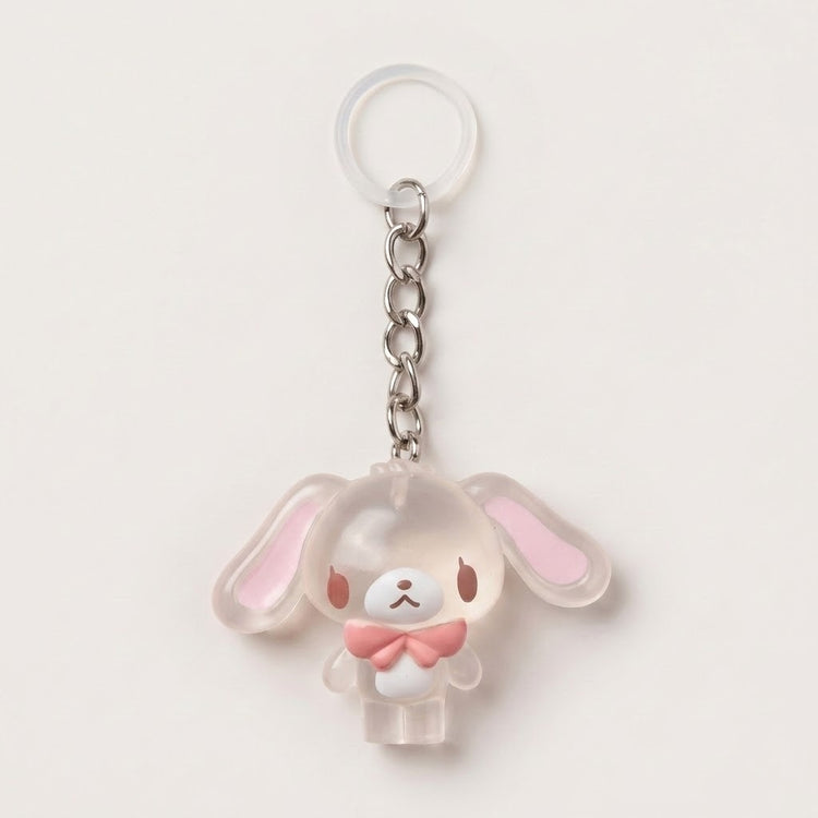 A translucent acrylic keychain charm shaped like a cute bunny character with long floppy ears, a silver metal chain, and a clear plastic key ring, shown on a plain light background.