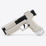 White and black water squirt gun with a textured grip and transparent reservoir rests against a plain white background.