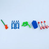 Disassembled launcher-and-3-rockets set of a rocket launcher toy laid out on a pale background, including blue legs, green hose, blue pump, and three red-and-white foam rockets.