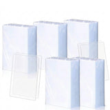 Five upright bundles of clear plastic card sleeves and four loose sleeves are displayed against a white background.