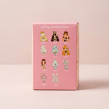 Pink blind box figure packaging displays rows of illustrated character options against a pale pink background.