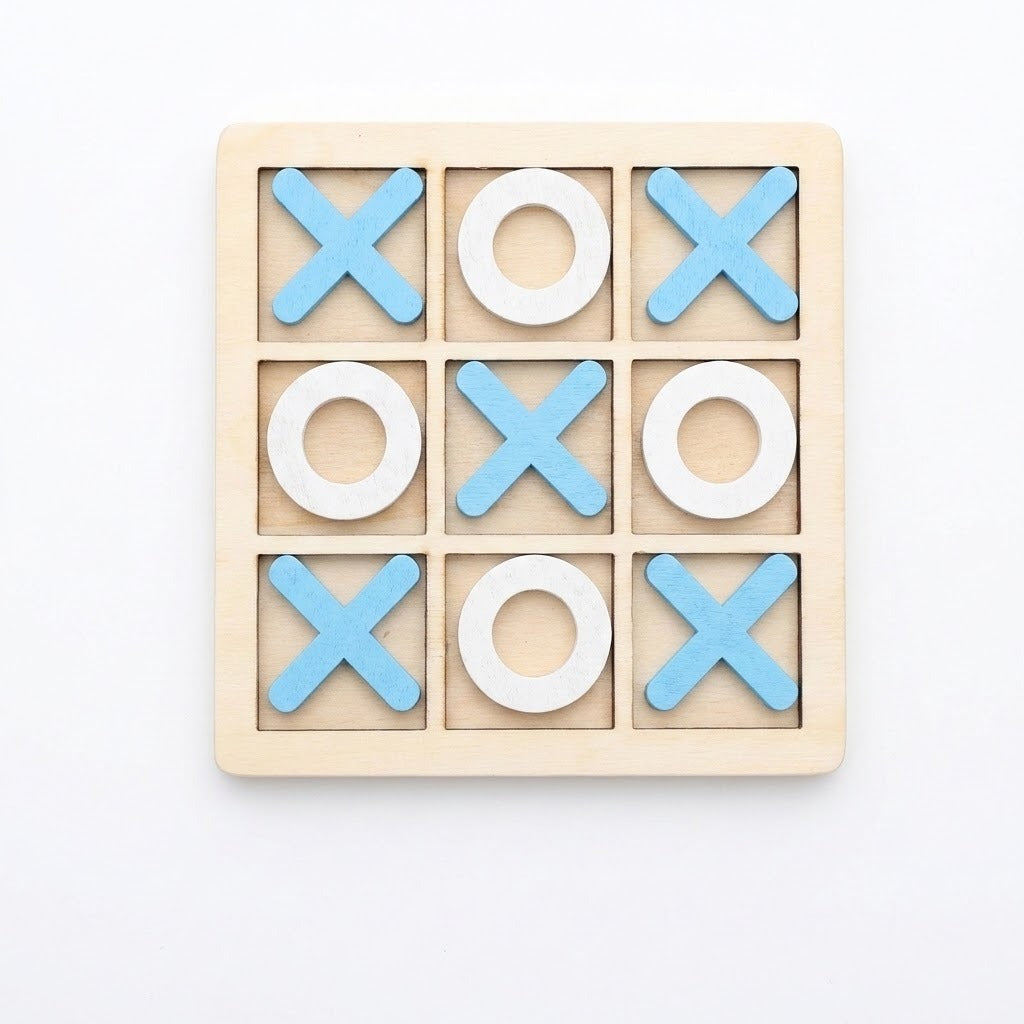 A wooden 3x3 tic-tac-toe game board with light blue X shapes and white O shapes, photographed from above on a plain white background.