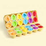 Matching egg set displays separated halves with colorful fruit and vegetable shapes in an open yellow case against a pale yellow background.