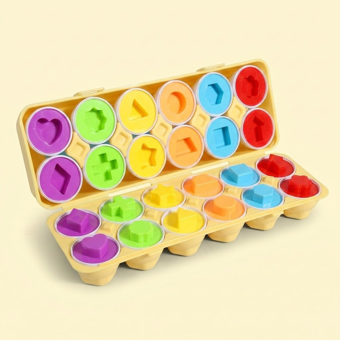 A matching egg set displays twelve split eggs with colorful geometric interiors in an open yellow case against a cream background.