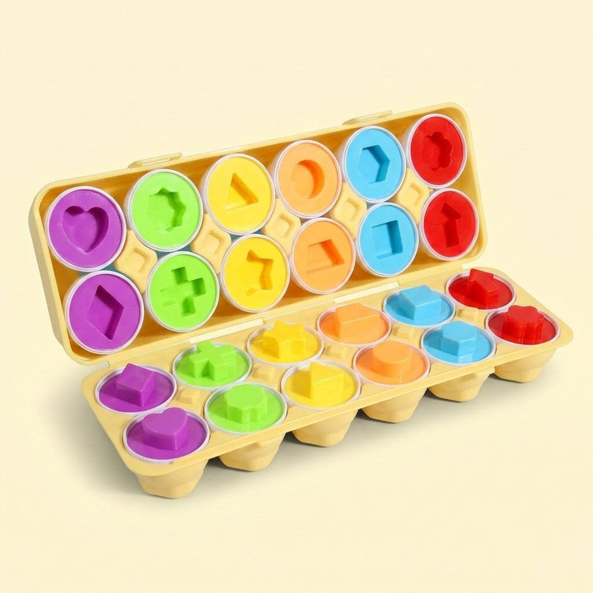 A matching egg set displays twelve split eggs with colorful geometric interiors in an open yellow case against a cream background.
