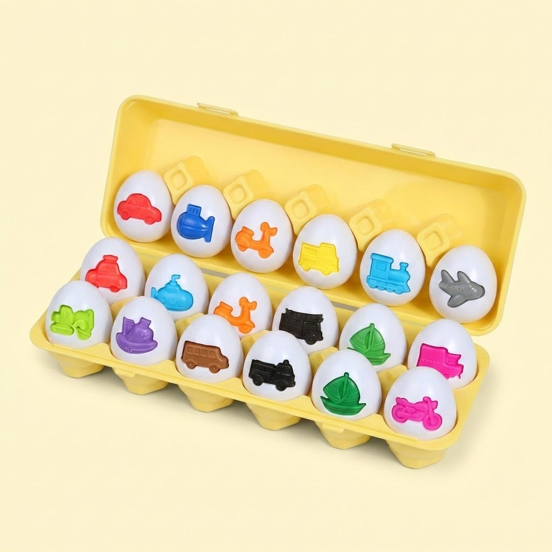 Matching egg set with white shells and colorful vehicle shapes sits in an open yellow case against a pale yellow background.