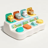 White pop-up toy with four raised animals and teal, orange, aqua, and yellow controls, angled against a white background.