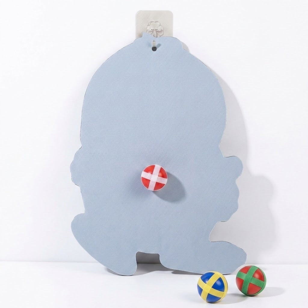 Sticky ball target showing its plain pale blue reverse on a white background, with one ball attached and two below.