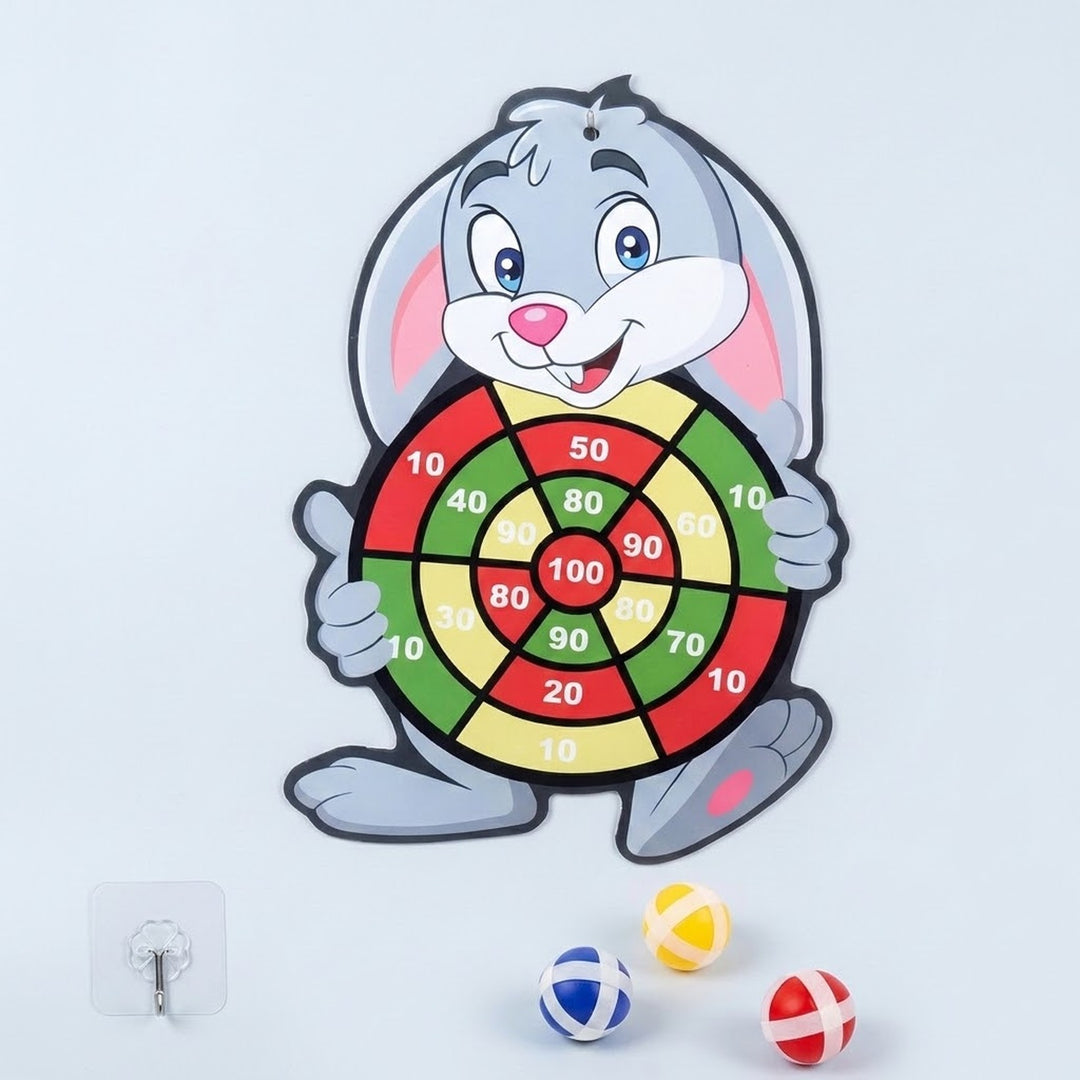 Gray rabbit sticky ball target with red, yellow, and green scoring sections, three colored balls, and a hanging hook on a pale background.