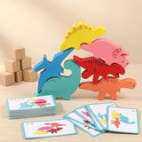 A colorful wooden dinosaur stacking toy set with four dinosaur figures in yellow, pink, red, and orange, a blue pterodactyl-like dinosaur, and matching illustrated cards on a light wood surface. Small wooden blocks are stacked in the background.