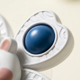 A close-up of the rabbit suction spinner toy shows a blue rounded insert and textured white arm against a cream background.