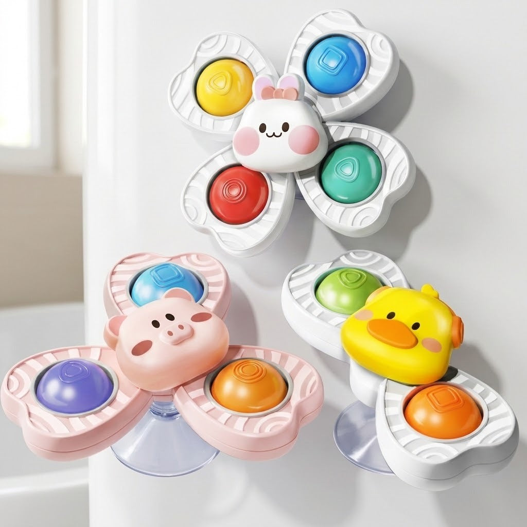 Rabbit, pig and duck suction spinner toys with colorful inserts are displayed against a smooth white surface beside a window.