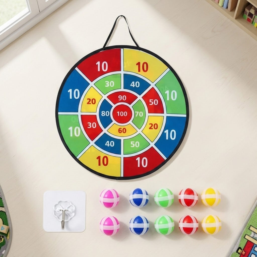 A colorful circular dartboard with numbered segments hangs on a light beige wall. Below the board, eight small plastic darts in pink, blue, green, red, and yellow are arranged, along with a white wall hook.