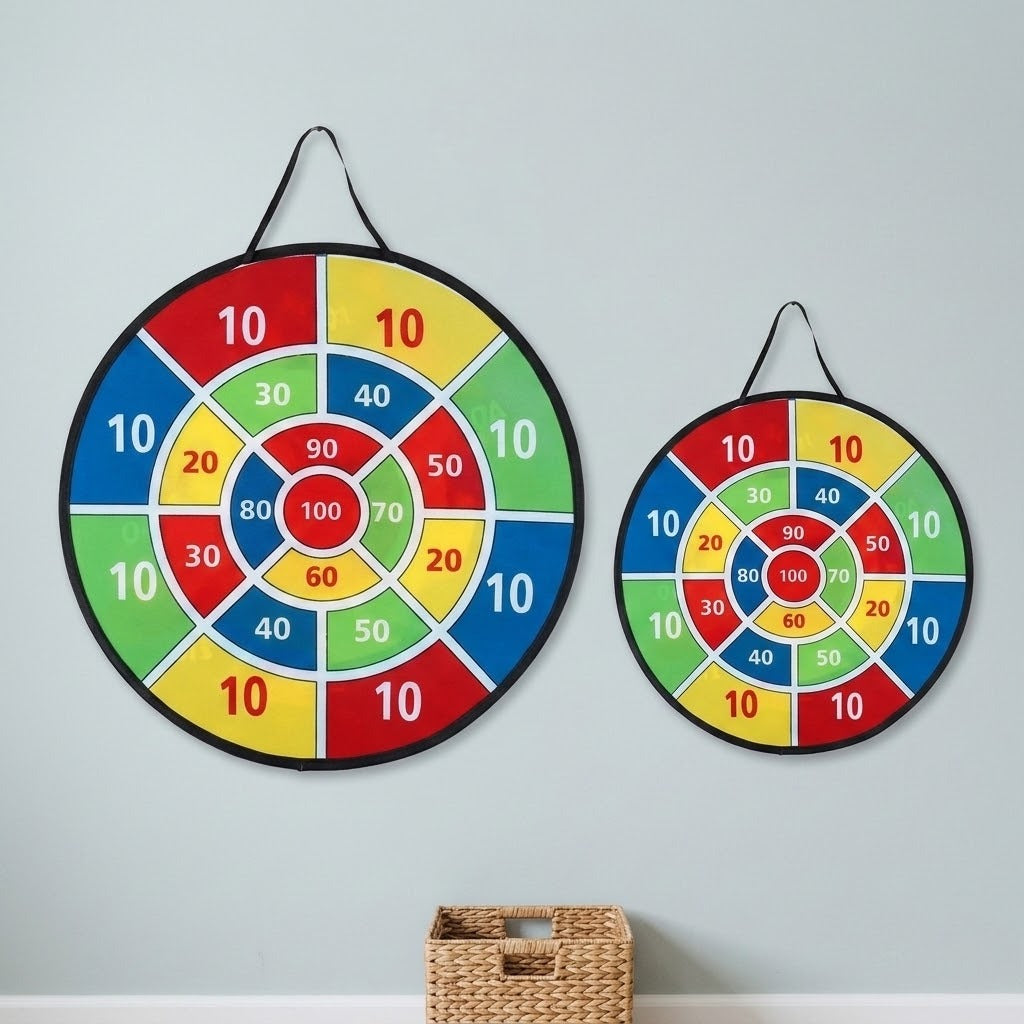 Two colorful cloth dart board sizes with numbered scoring sections hang side by side on a pale wall above a woven basket.
