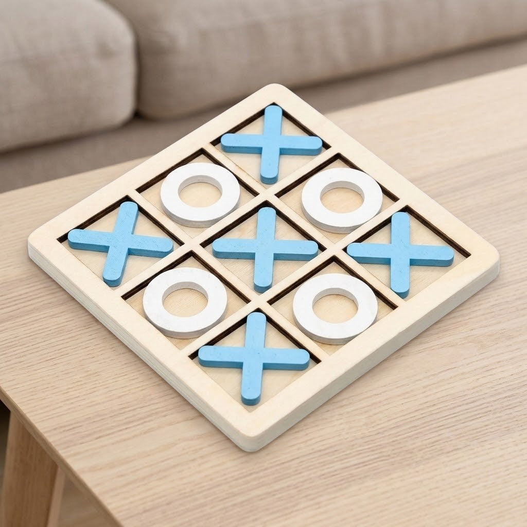 A wooden 3-player tic-tac-toe game board on a light wood table, with blue X-shaped pieces, white O-shaped pieces, and a beige board.