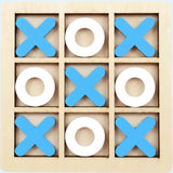 A wooden 3x3 tic-tac-toe game board with blue X shapes and white O shapes arranged on a light natural wood background.
