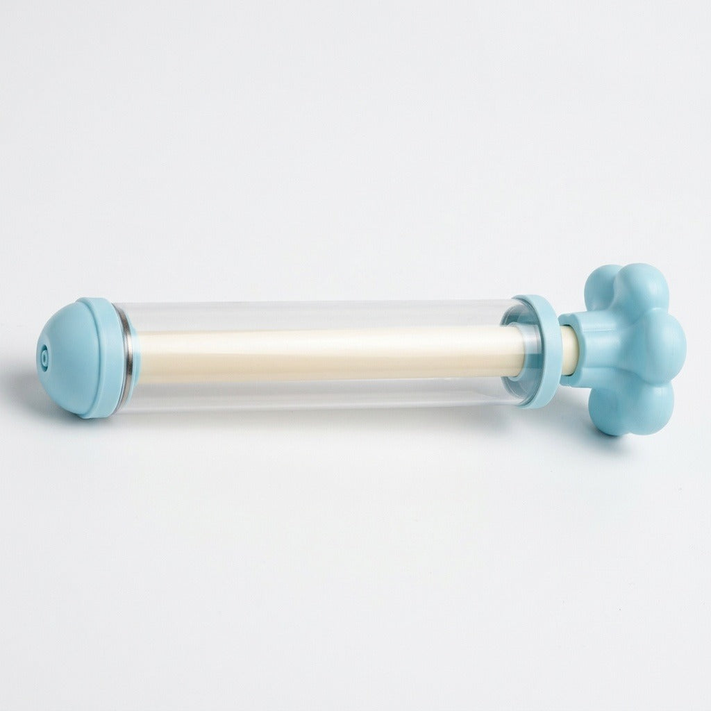 A light blue water gun with a clear barrel and cream inner shaft lies horizontally against a white background.