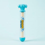 A clear plastic water gun toy with a light blue trigger top and base, featuring a beige grip in the center with 'Water Gun' printed in yellow and blue.