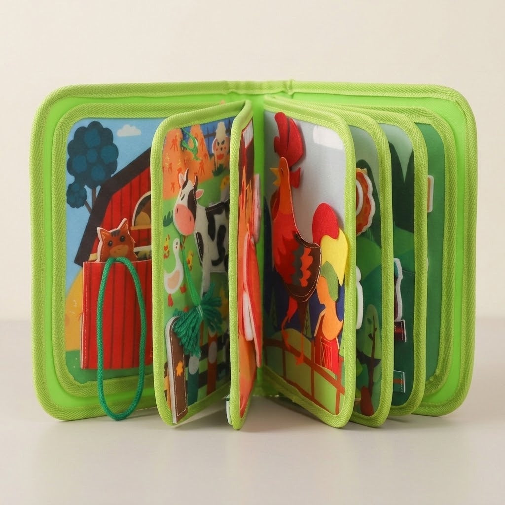 Green fabric busy book standing with pages fanned open, revealing colorful farm animals and activities against a cream background.