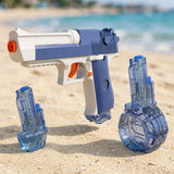 Blue-and-white toy water gun with orange accents beside two detached transparent blue reservoirs on sandy beach with sea behind.