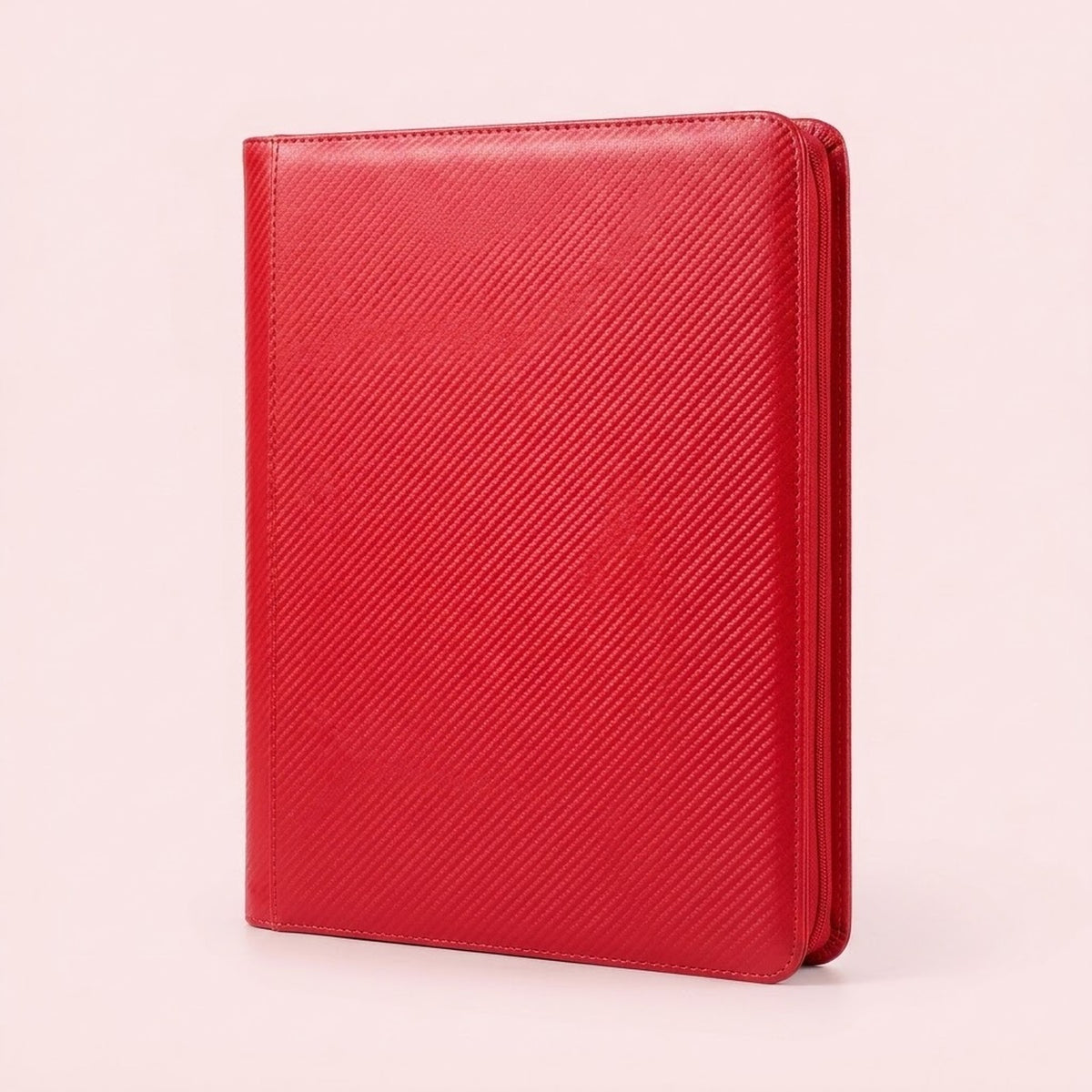 Upright red zippered trading card binder with a diagonally textured cover and stitched edges on a plain light background.