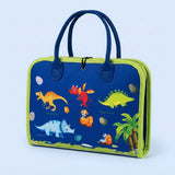 Blue felt busy board shown closed with lime green trim, carrying handles, and cartoon dinosaur illustrations against a pale blue background.